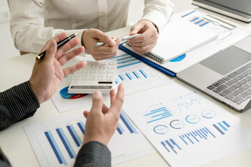 Young business people working together on new project. Colleagues at coworking. Startup concept.