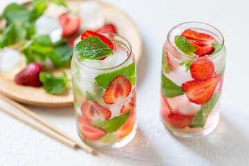 Refreshing water with strawberries and mint. Summer drink. Ingredients