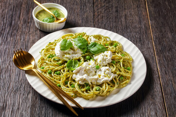 pesto spaghetti with green peas and burrata cheese