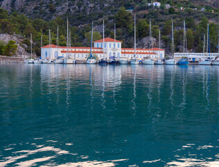 Marina (harbor) with a hydrotherapy clinic and yachts with water from thermal springs at the Greek...