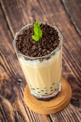 Fruity Bubble Tea in glass cup on wooden background