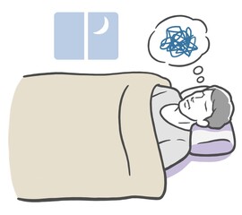 悩み事で眠れない若い男性