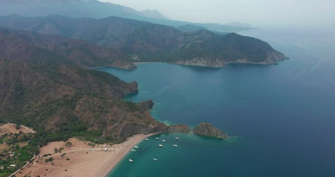 Aerial drone of Cirali beach and Olympos Olimpos mountain in a beautiful day light. Kemer, Antalya, Mediterranean region, Turkey, Lycia. Perfect sea view, nice for eyes of traveler.