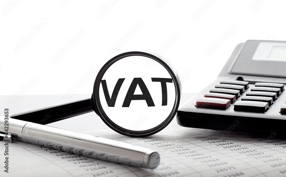 Poster vat concept. magnifier glass with text on chart with pen and calculator