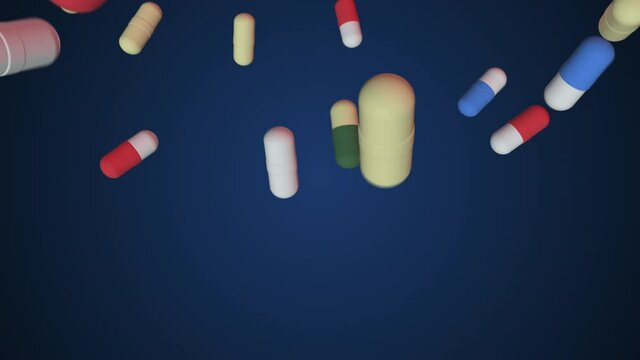 Super slow-motion shooting of colorful pills falling to the bottom. Loop, alpha channel. Medicines, tablets, capsules, painkillers, antibiotics, vitamins, Medicine, healthcare pharmacy concept