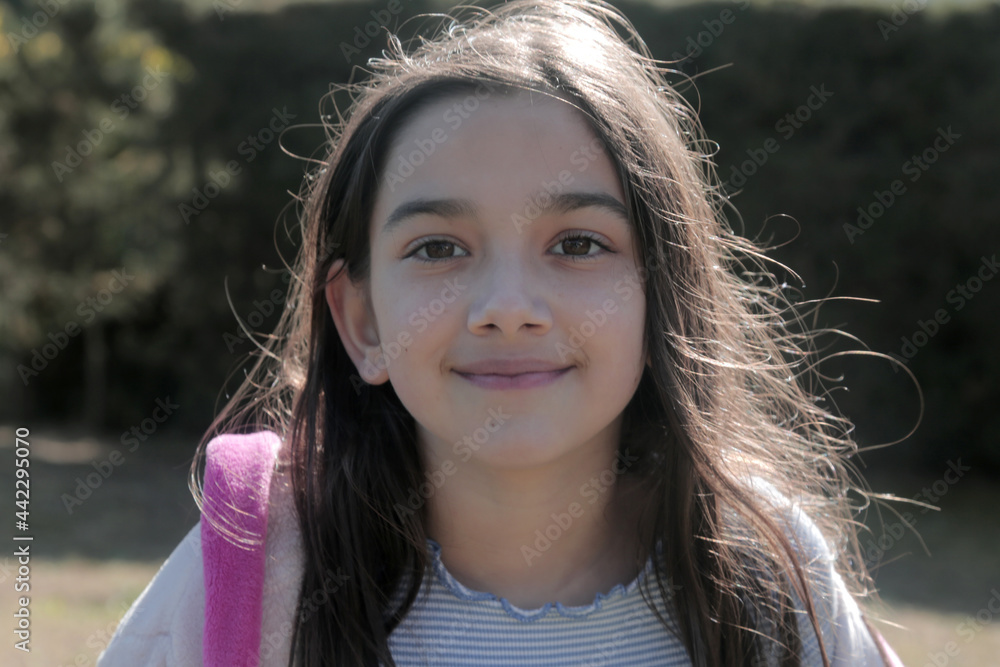 Wall mural child face portrait smiling with back light