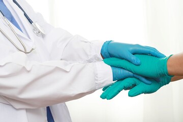 The doctor and the medical team wear gloves to prevent the unity of working together.