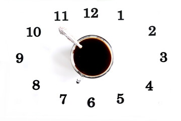 concept morning coffee. Cup of black strong coffee with spoon isolated in white background in circle dial of clock digit with copy space. Top view