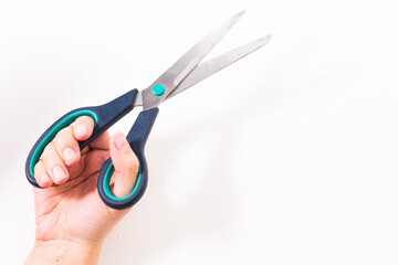 scissors in hand on a white background