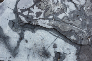 Rocks and stone textures. Texture or background surface of gray large river stone.