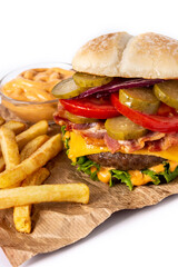 Beef burger with cheese, bacon and french fries isolated on white background