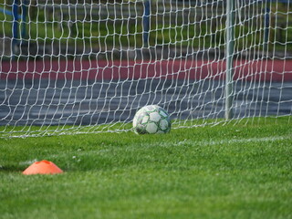 soccer ball in goal net