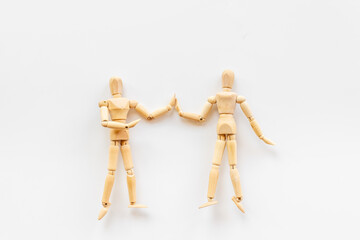 Two wooden figure connection - emotional communication concept