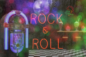 Jukebox in Bar with Neon Signs - Rock and Roll Rainy Window Image