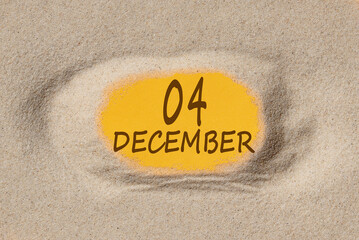 December 4. 4th day of the month, calendar date. Hole in sand. Yellow background is visible through hole. Winter month, day of the year concept