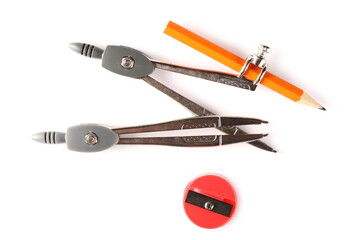 Divider with graphite pencil attachment and round plastic sharpener isolated on white background, top view