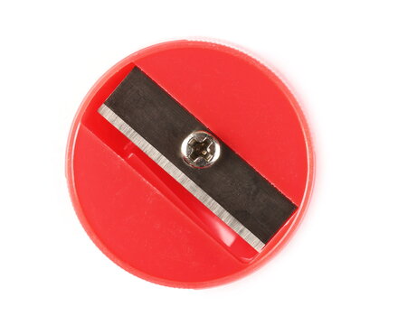 Round red plastic pencil sharpener isolated on white background, top view