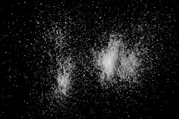 Fototapeta na wymiar Sea salt crystals isolated on black background, top view