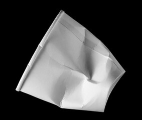 Disposable empty crumpled paper cup isolated on black background, clipping path