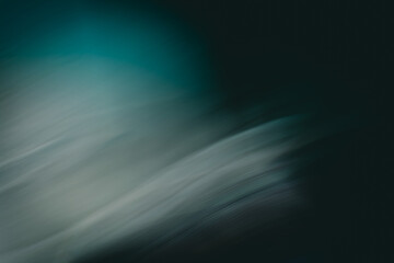 Abstract dark background imitation of water and light in blue tones.