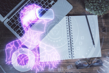 AR hologram drawings over computer on the desktop background. Top view. Multi exposure. Concept of augmented reality.