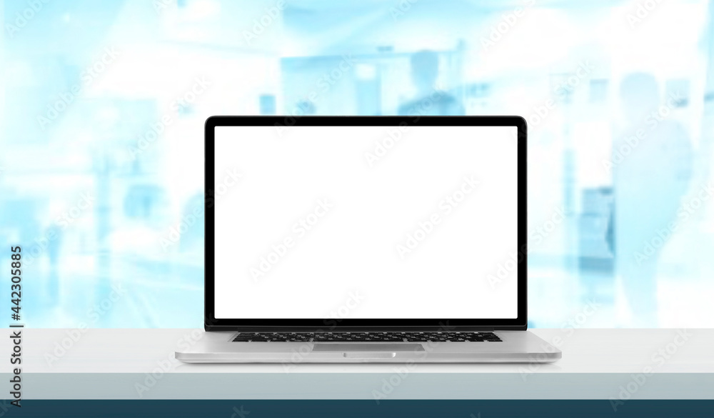 Aufkleber laptop or notebook with blank screen on hospital service counter in blurry background with operating