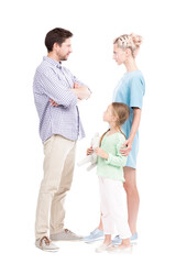 Vertical full length shot of little girl standing with her father and mother watching them quarrelling about something, white background