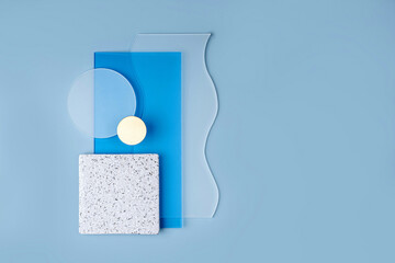 Different  transparent acrylic sheets. Blue background with geometric shapes