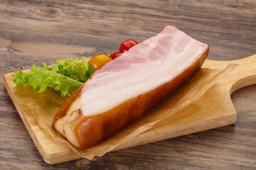Smoked pork breast with salad leaves