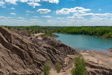Landscape with blue lake and white clouds