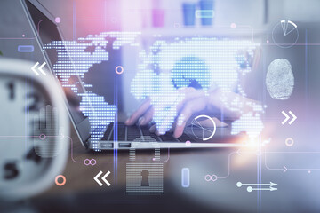 Double exposure of woman hands working on computer and world map hologram drawing. International technology business concept.