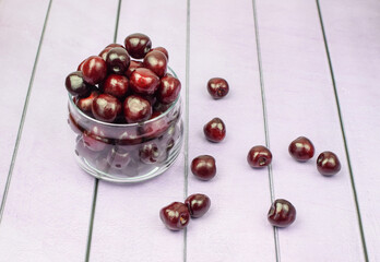 Sweet cherries in glassware. Concept of healthy and proper nutrition, diet, low calories. Top and side view. Selective focus.