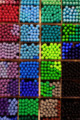 assortment of colorful pen stored in rack