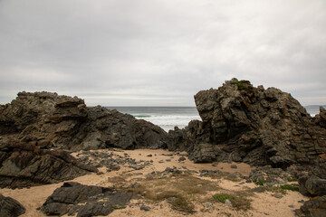 Fototapeta na wymiar Huge rocks next to the ocean