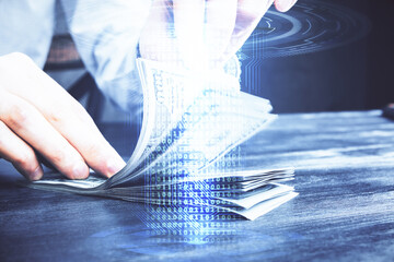 Double exposure of technology drawing hologram and us dollars bills and man hands. Data concept