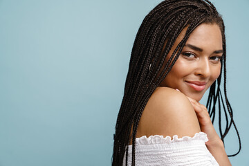 Portrait of a smiling young african woman with dreadlocks