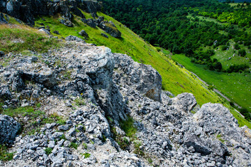 Fototapeta na wymiar Beautiful green landscapes with hills, forest and rocks in Moldova. Eco tourism without people.