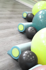 Colored balls and rollers for pilates classes