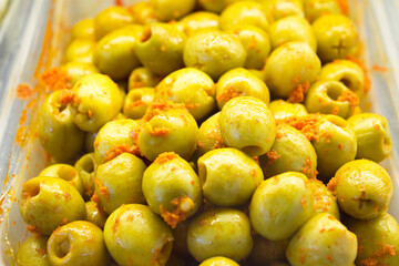 Pitted and pitted green olives with pepper and carrot