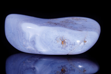 Macro mineral blue agate sapphirin in the rock on black background