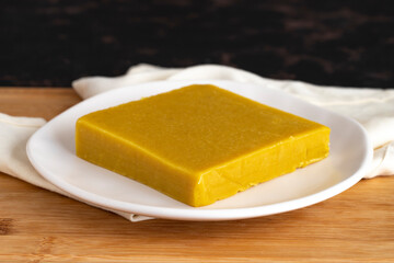 Almond halva. Halva on wooden background. Turkish halvah for Breakfast. Local name badem helvası