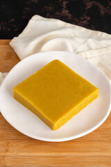 Almond halva. Halva on wooden background. Turkish halvah for Breakfast. Local name badem helvası