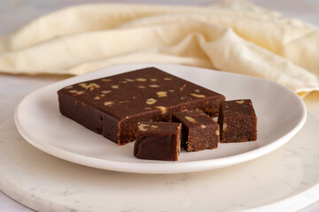 Walnut halva. Halva on wooden background. Turkish halvah for Turkish Breakfast. Local name cevizli helva