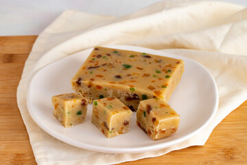 Fruit halva. Halva on wooden background. Turkish halvah for Turkish Breakfast. Local name meyveli yaz helvası