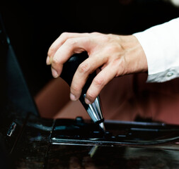 Woman holding on to a gearstick