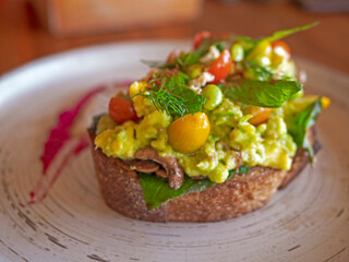 Avocado salad on soft crispy bread