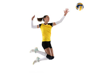 Female professional volleyball player with ball isolated on white studio background. The athlete,...