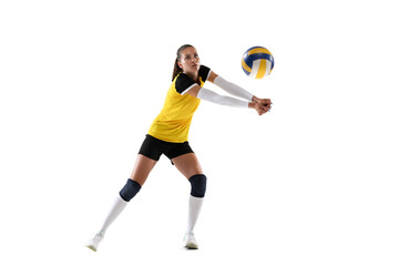 Female professional volleyball player with ball isolated on white studio background. The athlete,...