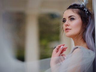 a beautiful woman like a fairy or nymph walking in the park