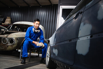 Fototapeta na wymiar entrepreneur businessman small business owner, paint garage, car repair shop